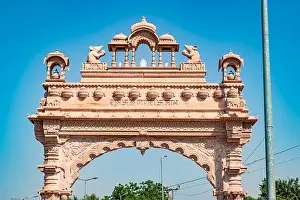 Carvings Prints: artistic temple entrance gate with bright blue sky at morning from flat angle image is taken at ratanada jodhpur