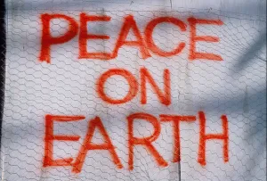 Social Issues Prints: Artwork. Graffiti message painted on wall. 'Peace on Earth'