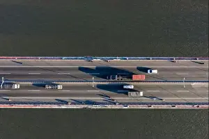 Top ascending aerial view of cable- stayed Can Tho bridge road with driving cars