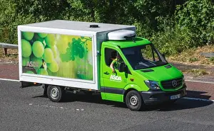 Hours Prints: Asda on-line supermarket delivery; Mercedes Benz vehicle driving on the M6 motorway, UK