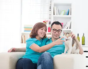 Pleasant Prints: asian couple with cat, chinese south east asian ethnicity