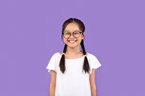 Empty Space Prints: Asian Kid Girl Wearing Eyeglasses Smiling Posing Over Purple Background