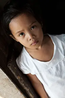 Young Girl Prints: Asian young girl portrait in natural light - Filipina child from impoverished neighborhood in Philippines