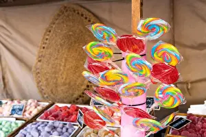 Assortment of lollipops and coloured jelly sweets in the shop. Traditional market, copy space