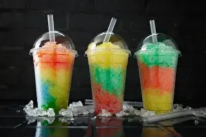 Favor Prints: Assortment of various slush drinks in a row on black and dark background