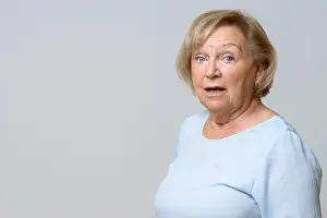 Disorder Prints: Astonished senior woman looking at the camera with wide eyes and open mouth