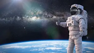 Milky Way Prints: astronaut showing thumbs up during spacewalk in Earth orbit