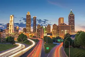 Atlanta, Georgia, USA downtown city skyline over Freedom Parkway at dusk