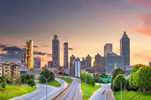 Atlanta, Georgia, USA downtown city skyline over Freedom Parkway at dusk