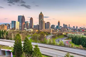 Atlanta, Georgia, USA downtown city skyline over highways at dusk