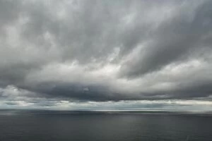 Images Dated 5th August 2019: Atlantic ocean water and dramatic cloudy sky background. Sea water texture closeup