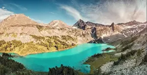 View Peak Prints: Atmospheric and moody aerial drone point of view of turquoise Krepkoe Lake at sunset
