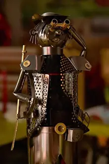 Metal Sculpture Prints: Attention! A small tin soldier with a human face, portrait in low light