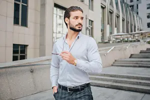 Freelancer Prints: Attractive dark-haired businessman stands and poses