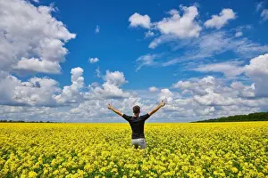 Canola Prints: Attractive man with arms outstretched