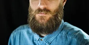Hippie Prints: Attributes of the Appearance of a Hipster Male: Mustache and Beard Close Up