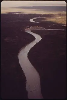 This August 1973 photograph shows the Tazlina River crossing along the pipeline route