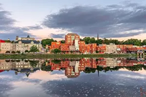 Augusta, Maine, USA downtown skyline on the Kennebec River at dawn