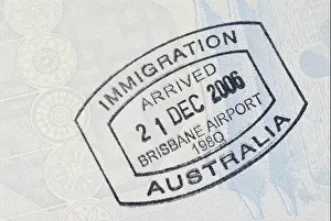 Leaving Prints: Australia immigration entry stamp on the inside page of a passport. Space for copy