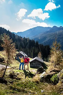 Heterosexual Prints: Austria, Altenmarkt-Zauchensee, young couple looking at view