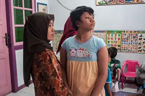 Disorder Prints: An autistic girl interact with her therapist in Makassar, Indonesia