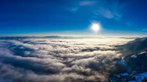 Sky Clouds Prints: Autumn flight through blue sky in Carpatian autumn mountains aerial panoramic drone shot