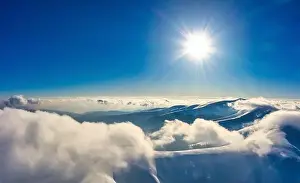 Autumn flight through blue sky in Carpatian autumn mountains aerial panoramic drone shot