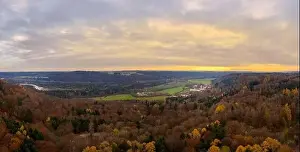 Tang Dynasty Prints: Autumn landscape with a colorful forest in fall next to a bavarian monastery captured by a drone