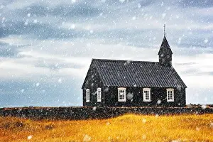 Autumn landscape with snowy famous picturesque black church of Budir at Snaefellsnes peninsula region in Iceland