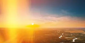 Air Pollution Prints: Autumn Sunshine Above Town Cityscape Skyline In Autumn Evening