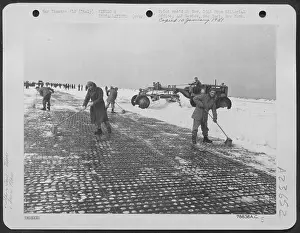 Snowstorm Prints: Every available tool was used to clear the runway of an airfield below sea level maintained by an engineers aviation