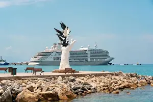 Cruise Vacation Prints: Aydin Kusadasi, Turkey - 4 July 2024: Hand of Peace Sculpture and cruise ship behind it in Kusadasi Aydin