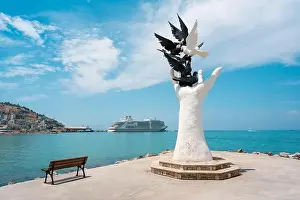 Cruise Vacation Prints: Aydin Kusadasi, Turkey - 4 July 2024: Hand of Peace Sculpture and cruise ship behind it in Kusadasi Aydin