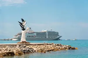 Cruise Vacation Prints: Aydin Kusadasi, Turkey - 4 July 2024: Hand of Peace Sculpture and cruise ship behind it in Kusadasi Aydin
