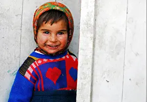 Preschooler Prints: Azerbaijan, Xinaliq, close-up portrait of cute young boy smiling with dirty mouth