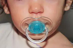 Pacifier Prints: Baby with pacifier in her mouth = Model Release Available