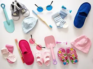 Toothbrush Prints: Baby shower flat lay concept. Newborn pastel pink and blue color clothing and accessories on white background