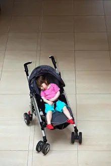 Asleep Prints: Baby Toddler sleeping in pram indoors