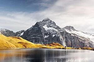 Images Dated 21st October 2018: Bachalpsee lake in Swiss Alps mountains. Snowy peaks of Wetterhorn