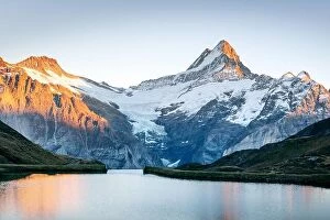 Images Dated 21st October 2018: Bachalpsee lake in Swiss Alps mountains on sunset. Snowy peaks of Wetterhorn
