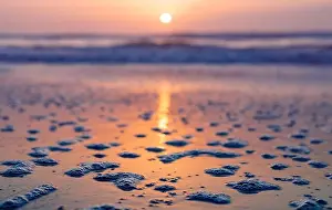 Calming Prints: Background of colorful ocean waves on sandy beach