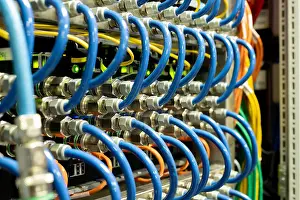 Datacenter Prints: Background image of modern network cables connected in switches in database server room