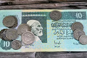 Libya Prints: Background of old Libyan money banknote bills and coins of different eras from the kingdom to Jamahiriya of Libya times