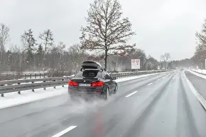 Snowing Prints: Bad weather, car traffic during heavy snowfall and rain on the A8 motorway