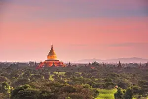 Bagan, Myanmar ancient temple ruins landscape with Ananda Temple in the archaeological zone at dusk