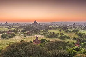 Bagan, Myanmar ancient temple ruins landscape in the archaeological zone at dusk