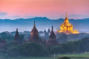 Bagan, Myanmar ancient temple ruins landscape in the archaeological zone at dusk