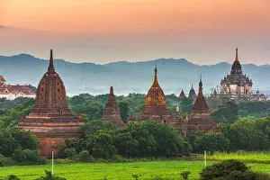 Bagan, Myanmar ancient temple ruins landscape in the archaeological zone at dusk