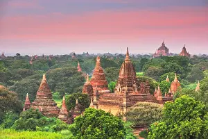Bagan, Myanmar ancient temple ruins landscape in the archaeological zone at dusk