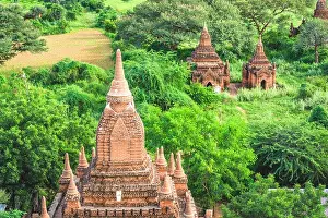 Bagan, Myanmar ancient temple ruins landscape in the archaeological zone at dusk